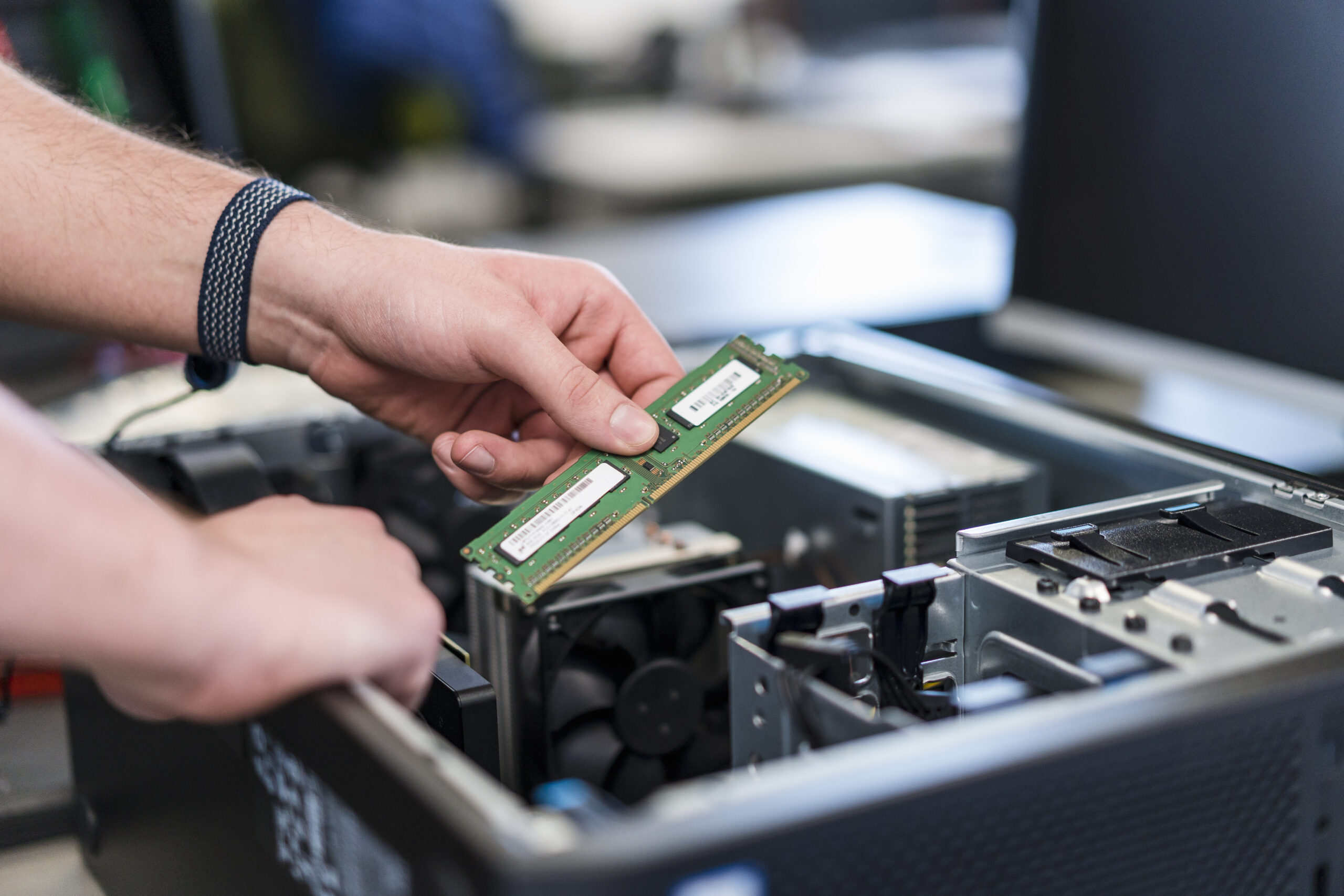 Close-up of teenager assembling personal computer